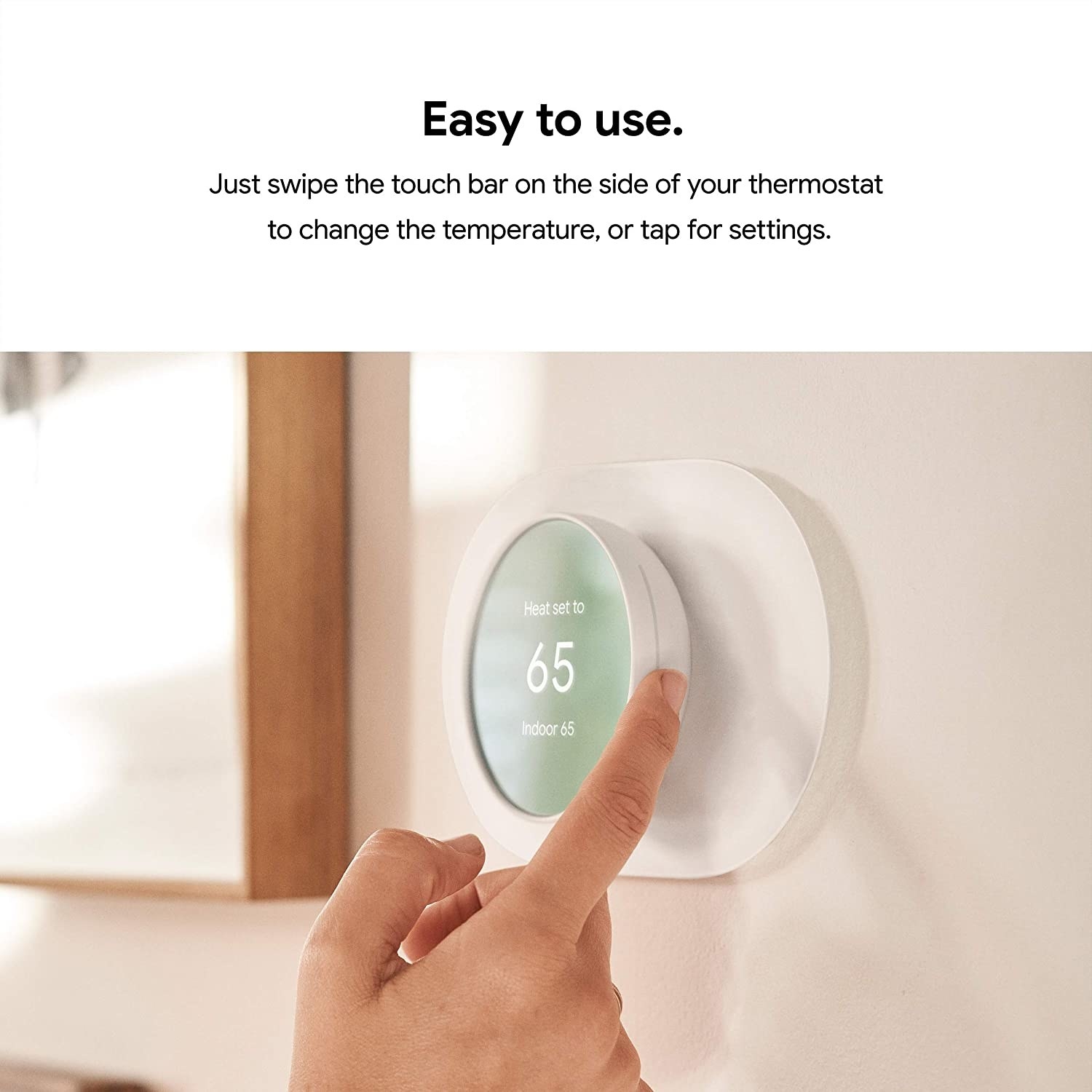 Model adjusting temperature on Google Nest thermometer
